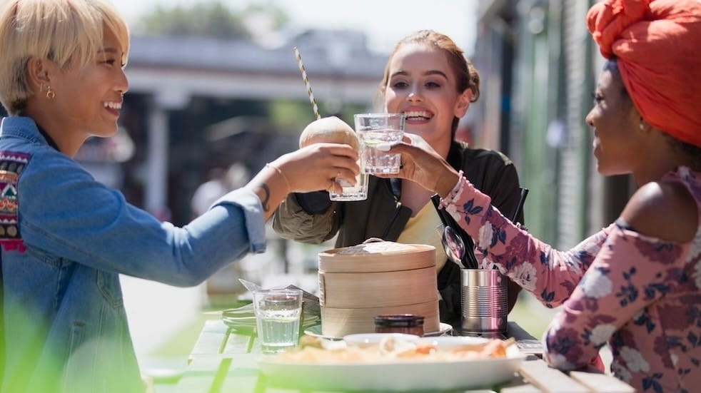 Women toasting their water glasses of lunch